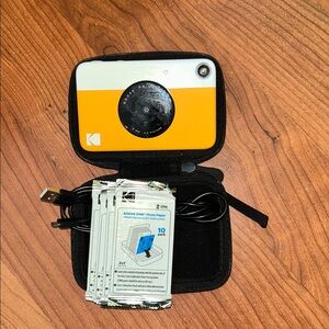 Kodak Instant Camera with photo paper, USB cable, and case
